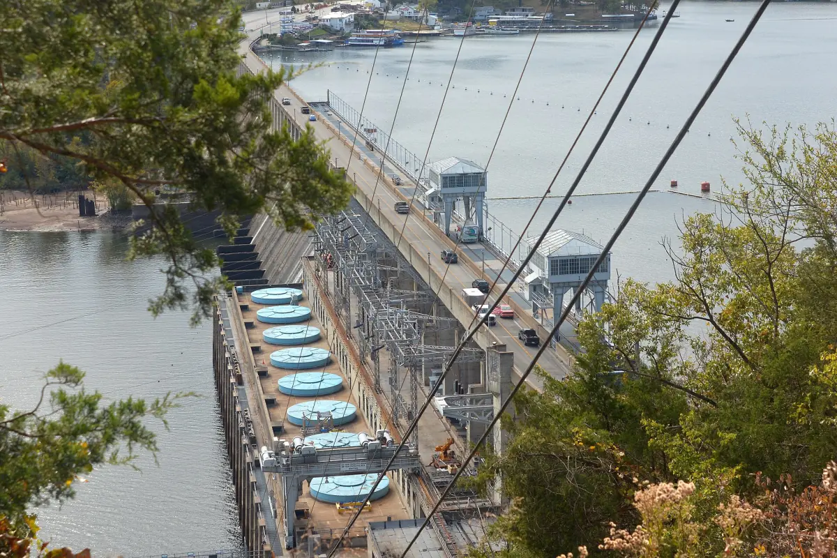 Bagnell Dam with its spillway gates seen from above beside the Osage River
